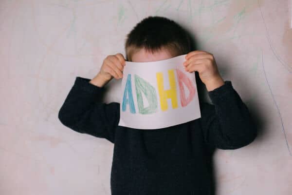 ADHD Sign Held by Little Boy