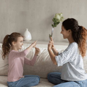 Mom practicing hand positioning with her daughter