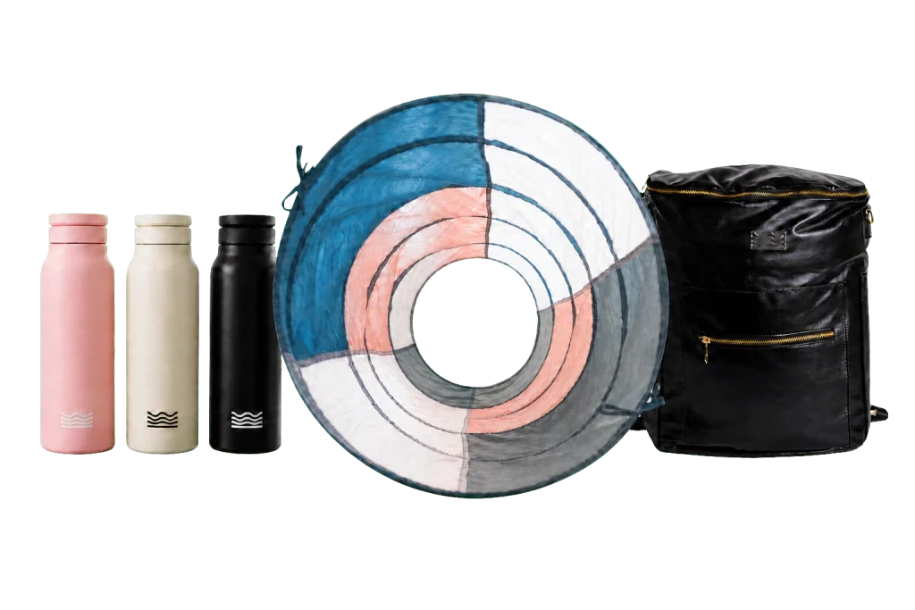 Three bottles, a colorful patterned circle, and a black backpack with a zipper.